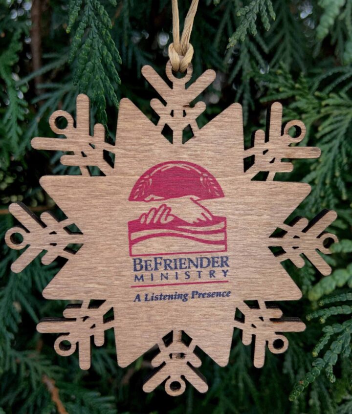 Wooden Christmas Ornament with the BeFriender logo on it